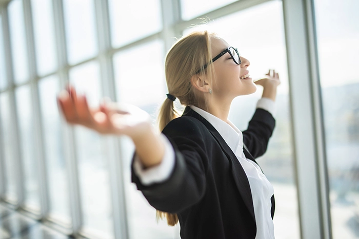 business woman excited lady happy knowing all WLA processes are taken care of with extended service